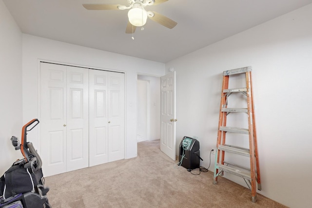 miscellaneous room featuring ceiling fan and light colored carpet