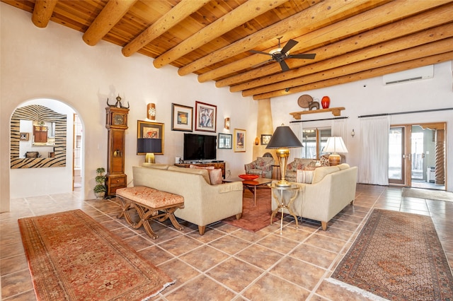 living room with wood ceiling, ceiling fan, tile patterned floors, an AC wall unit, and beamed ceiling