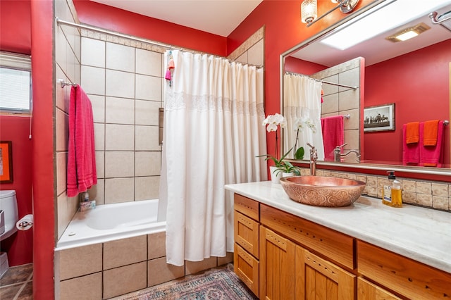 bathroom featuring vanity and shower / bath combo with shower curtain