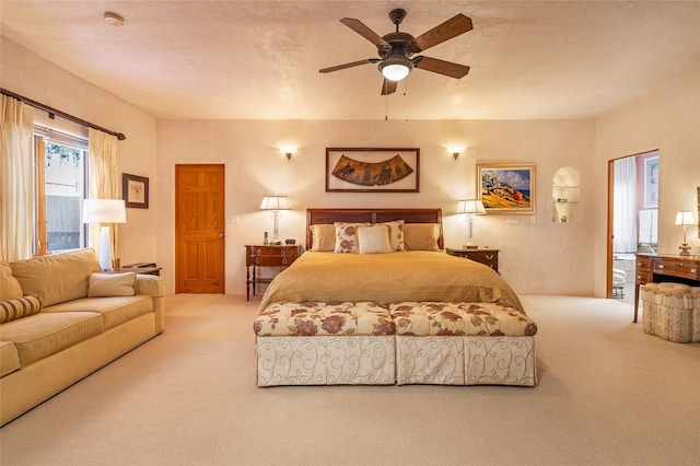 bedroom featuring ceiling fan and carpet