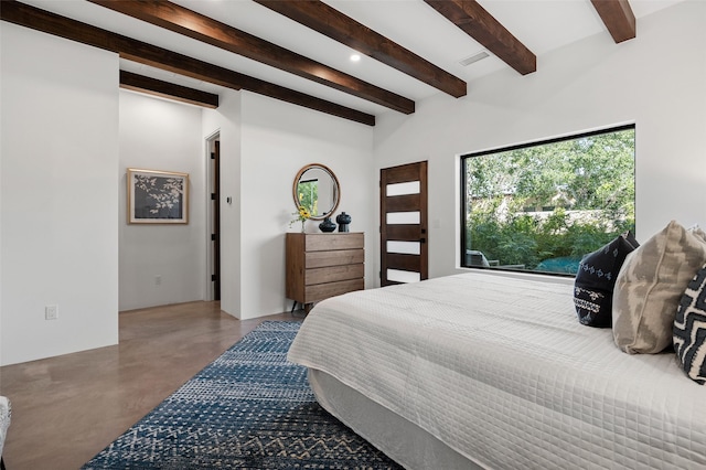 bedroom featuring beamed ceiling and concrete flooring