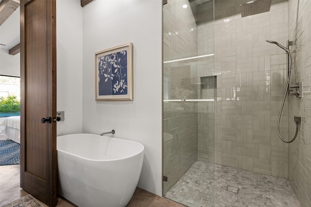 bathroom with shower with separate bathtub