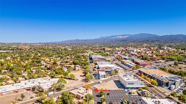 birds eye view of property with a mountain view