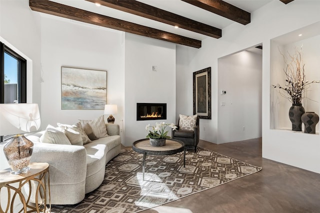 living room featuring beamed ceiling