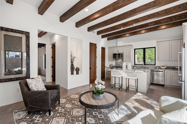 living room featuring beam ceiling