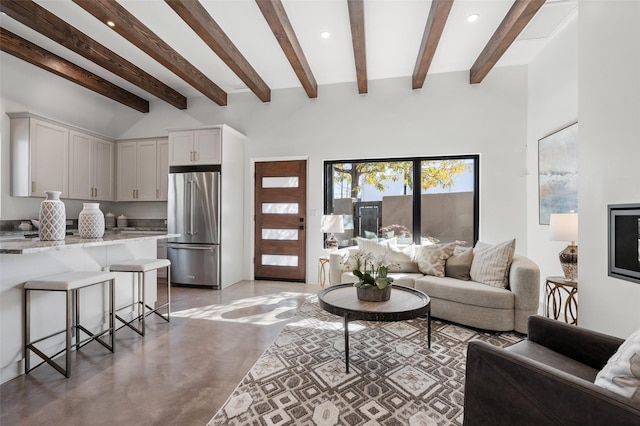 living room featuring high vaulted ceiling and beamed ceiling