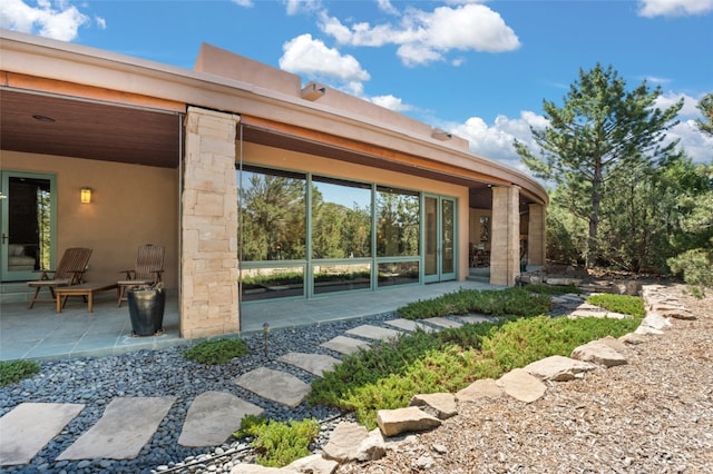 back of house featuring a patio area