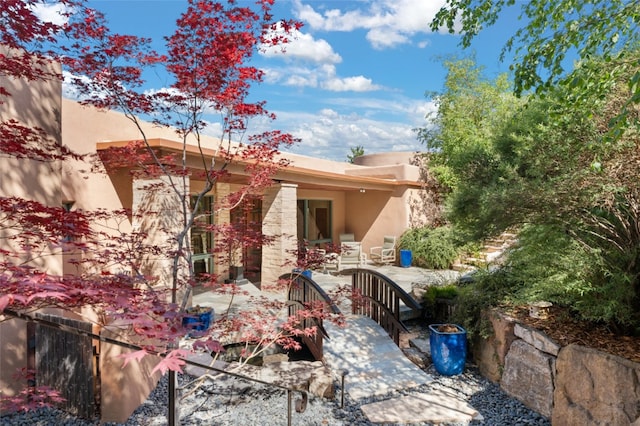 rear view of house with a patio