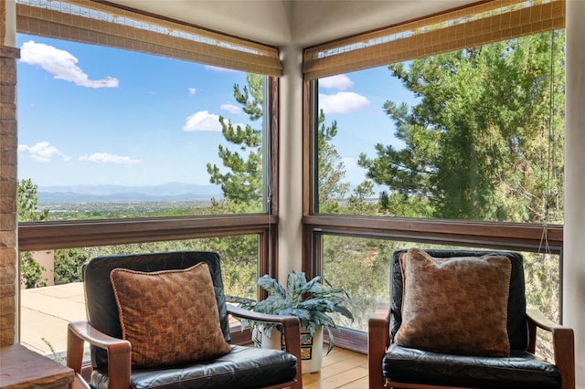 sunroom featuring a mountain view