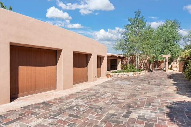 view of patio featuring a garage