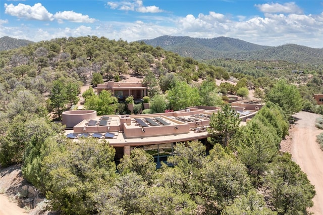 birds eye view of property with a mountain view