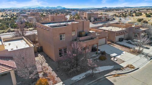 birds eye view of property with a mountain view