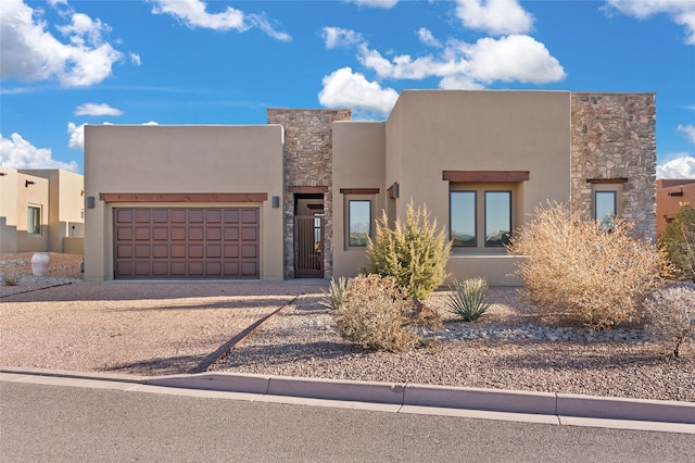 southwest-style home with a garage