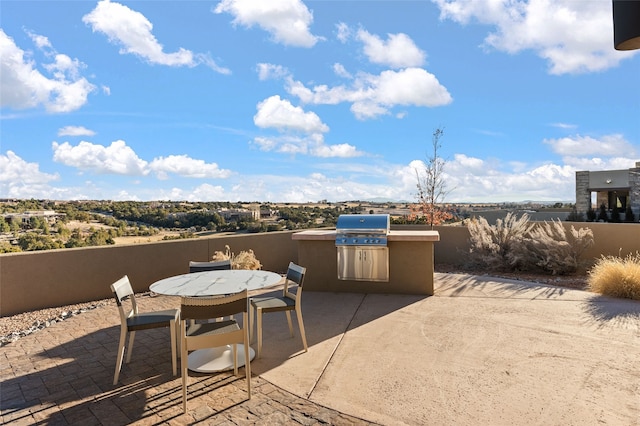 view of patio featuring grilling area and an outdoor kitchen