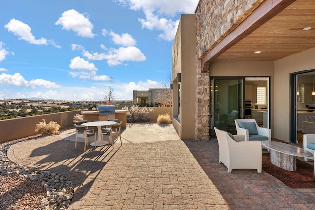 view of patio with a grill