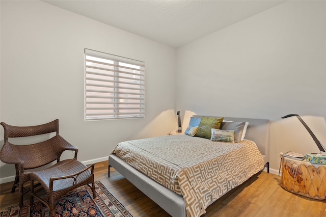 bedroom featuring hardwood / wood-style flooring