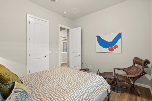 bedroom with wood-type flooring