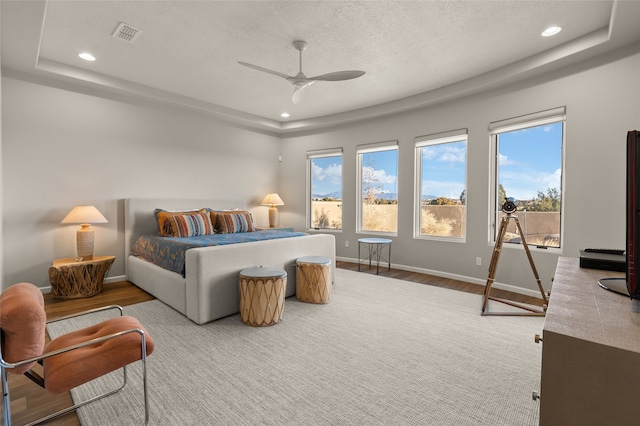 bedroom with ceiling fan and hardwood / wood-style floors