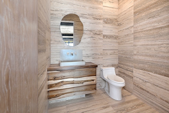 bathroom featuring toilet and vanity