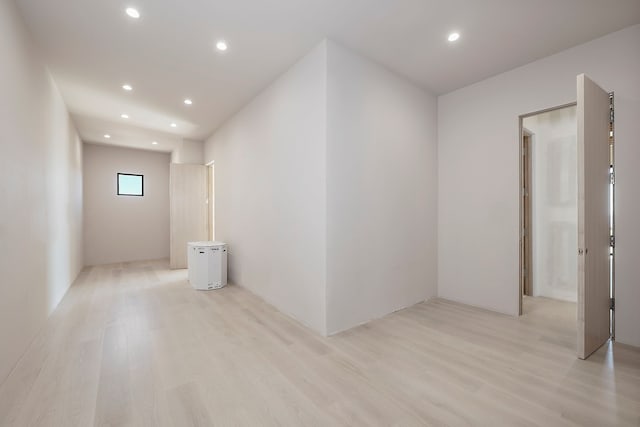 empty room with recessed lighting and light wood finished floors