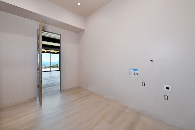 empty room featuring recessed lighting and light wood-type flooring