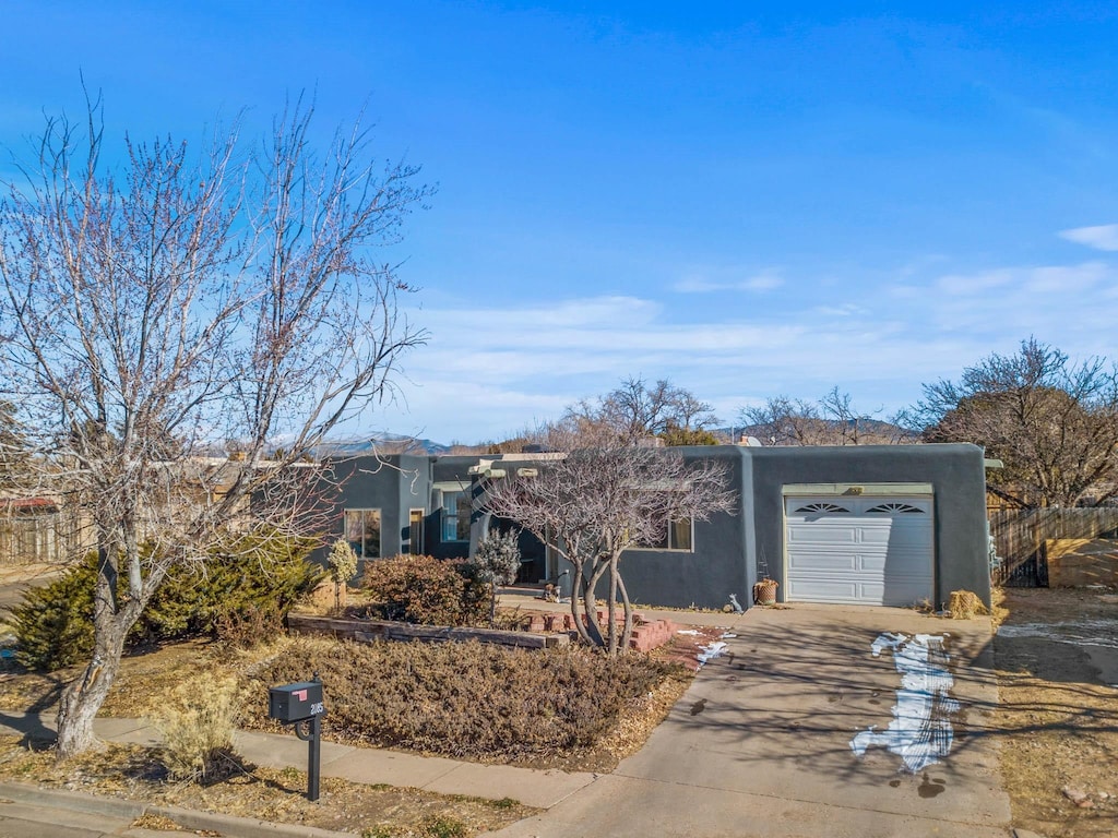 single story home with a garage