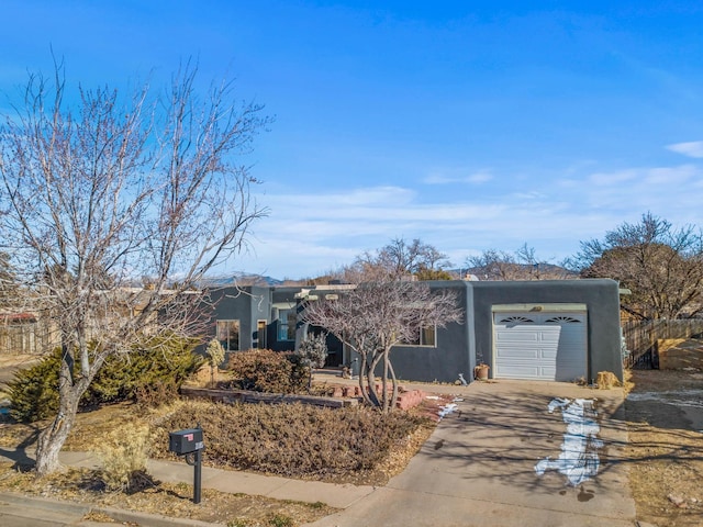 single story home with a garage