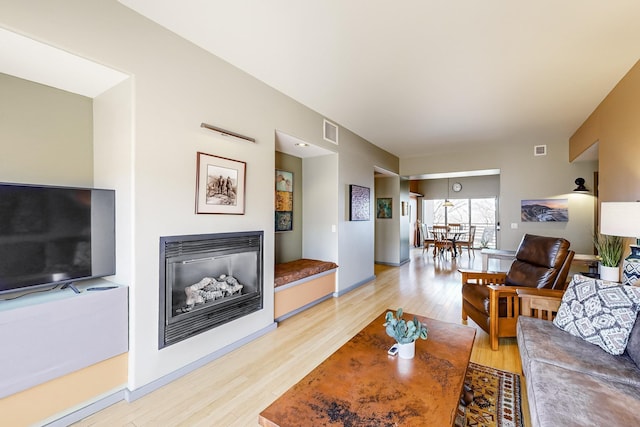 living room with light hardwood / wood-style flooring