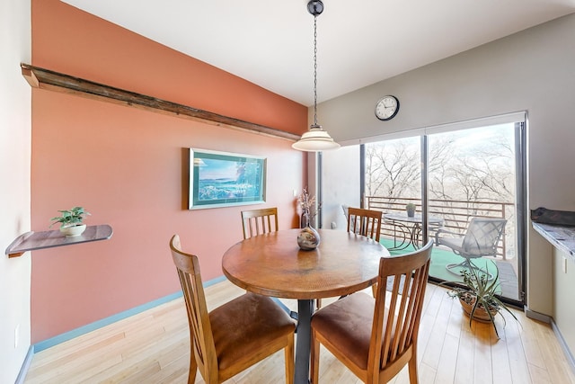 dining space with light wood-type flooring