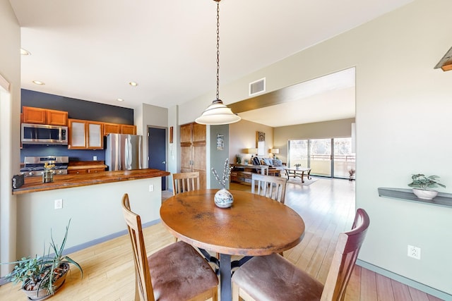 dining area with light wood-type flooring