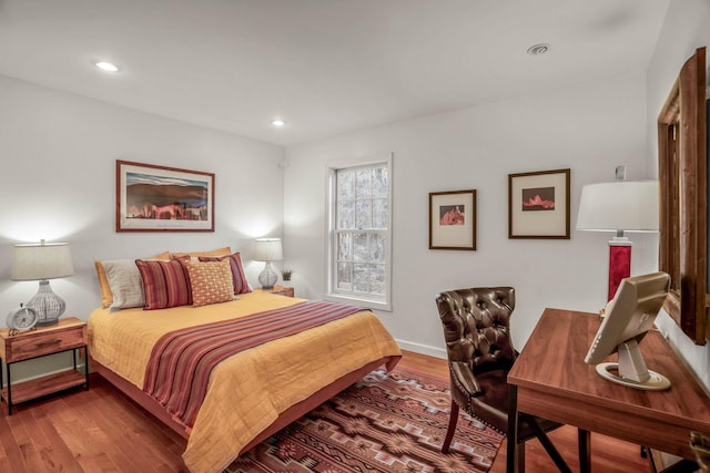 bedroom with wood-type flooring