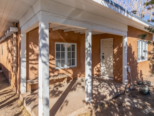 entrance to property featuring a patio area