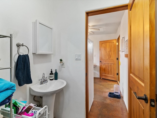 bathroom with unfinished concrete flooring