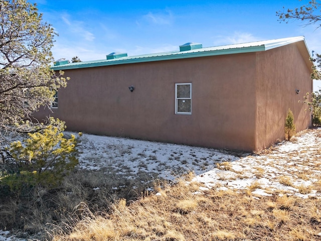 view of home's exterior featuring metal roof