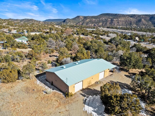 birds eye view of property with a mountain view