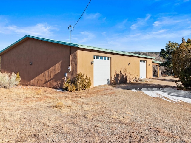 view of outbuilding with an attached garage