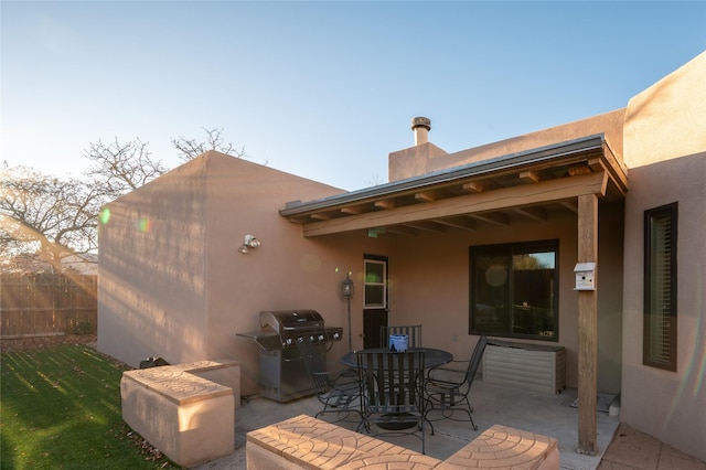 back of property with a patio