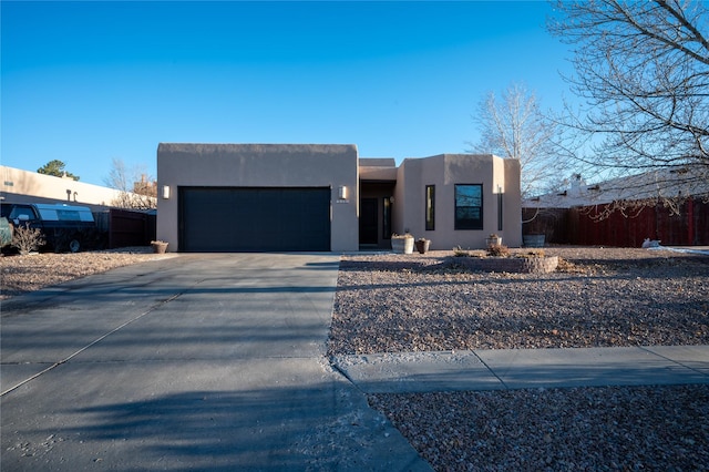 adobe home featuring a garage