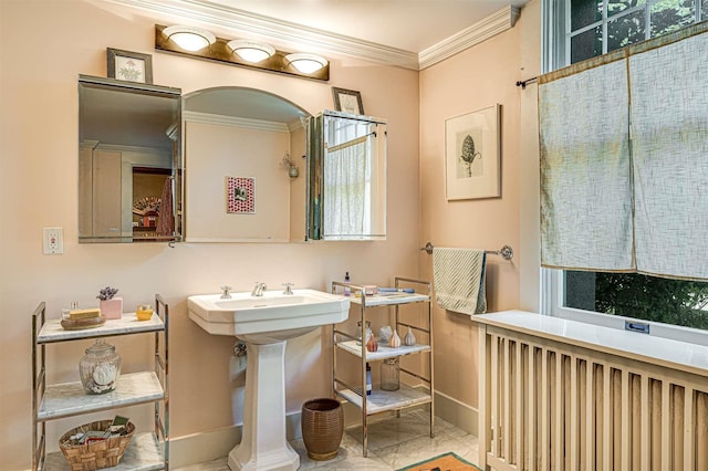 bathroom with crown molding, tile patterned floors, and radiator heating unit