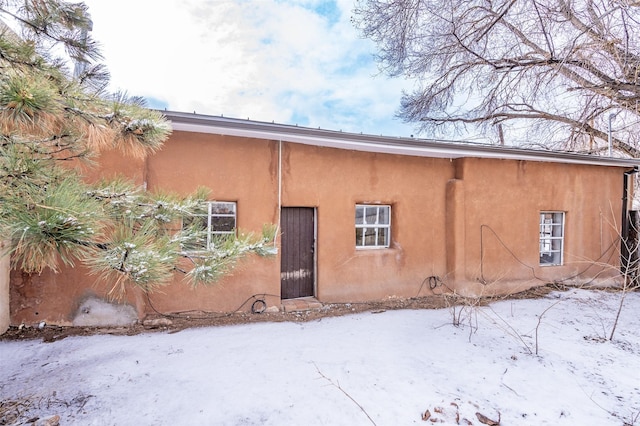 view of snow covered property