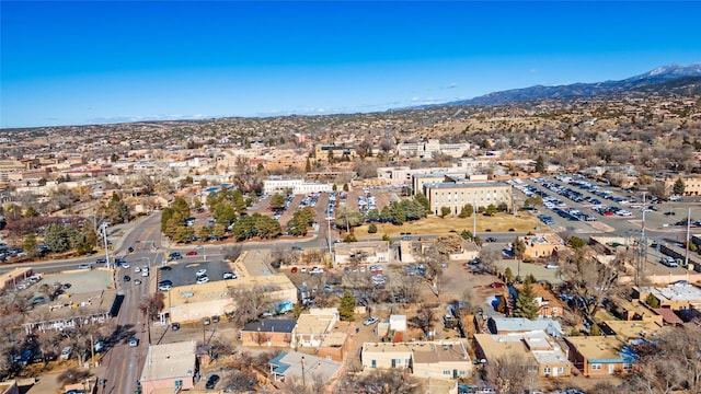 birds eye view of property featuring a mountain view