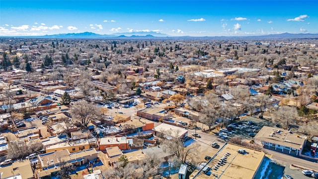 birds eye view of property featuring a mountain view