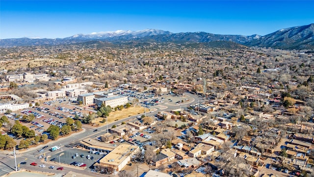 birds eye view of property featuring a mountain view