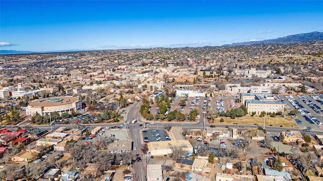 birds eye view of property featuring a mountain view