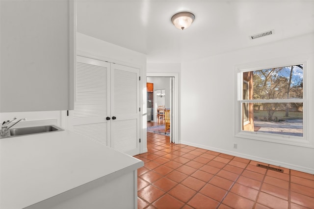 kitchen featuring sink and tile patterned floors