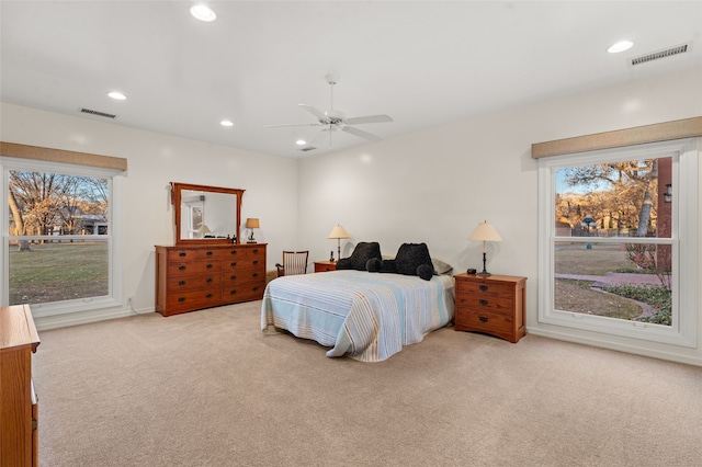 carpeted bedroom featuring ceiling fan