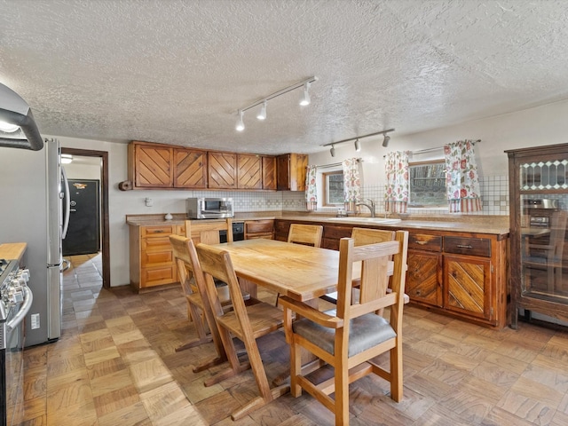 dining room with a textured ceiling