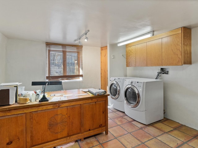 washroom featuring light tile patterned floors, laundry area, and separate washer and dryer