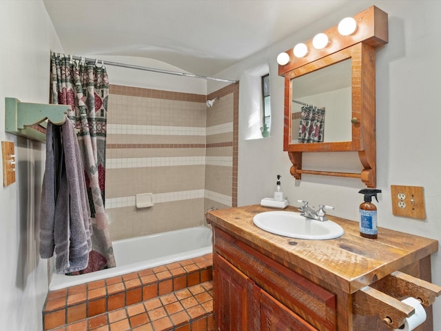 bathroom featuring vanity and shower / tub combo with curtain