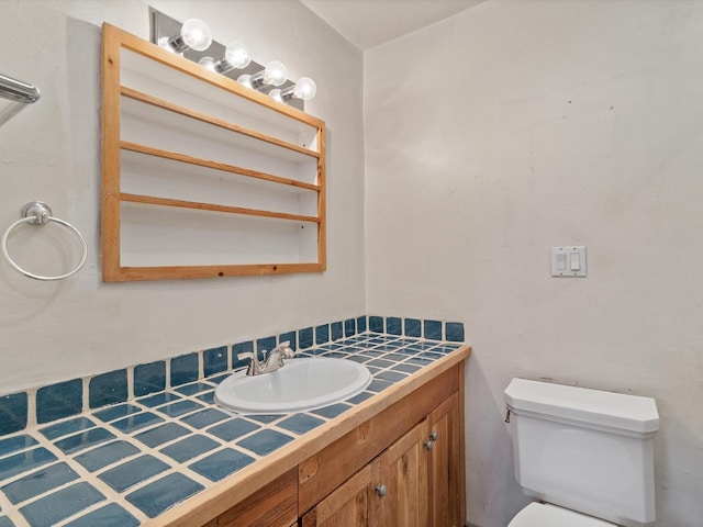 half bathroom featuring toilet and vanity